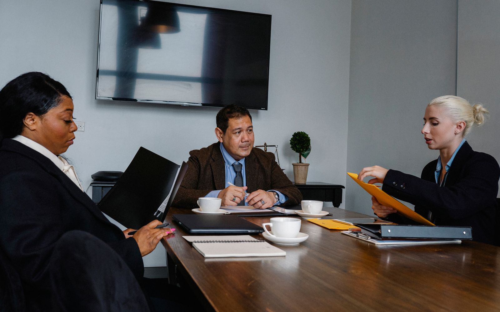Two colleagues assessing a business against acquisition criteria