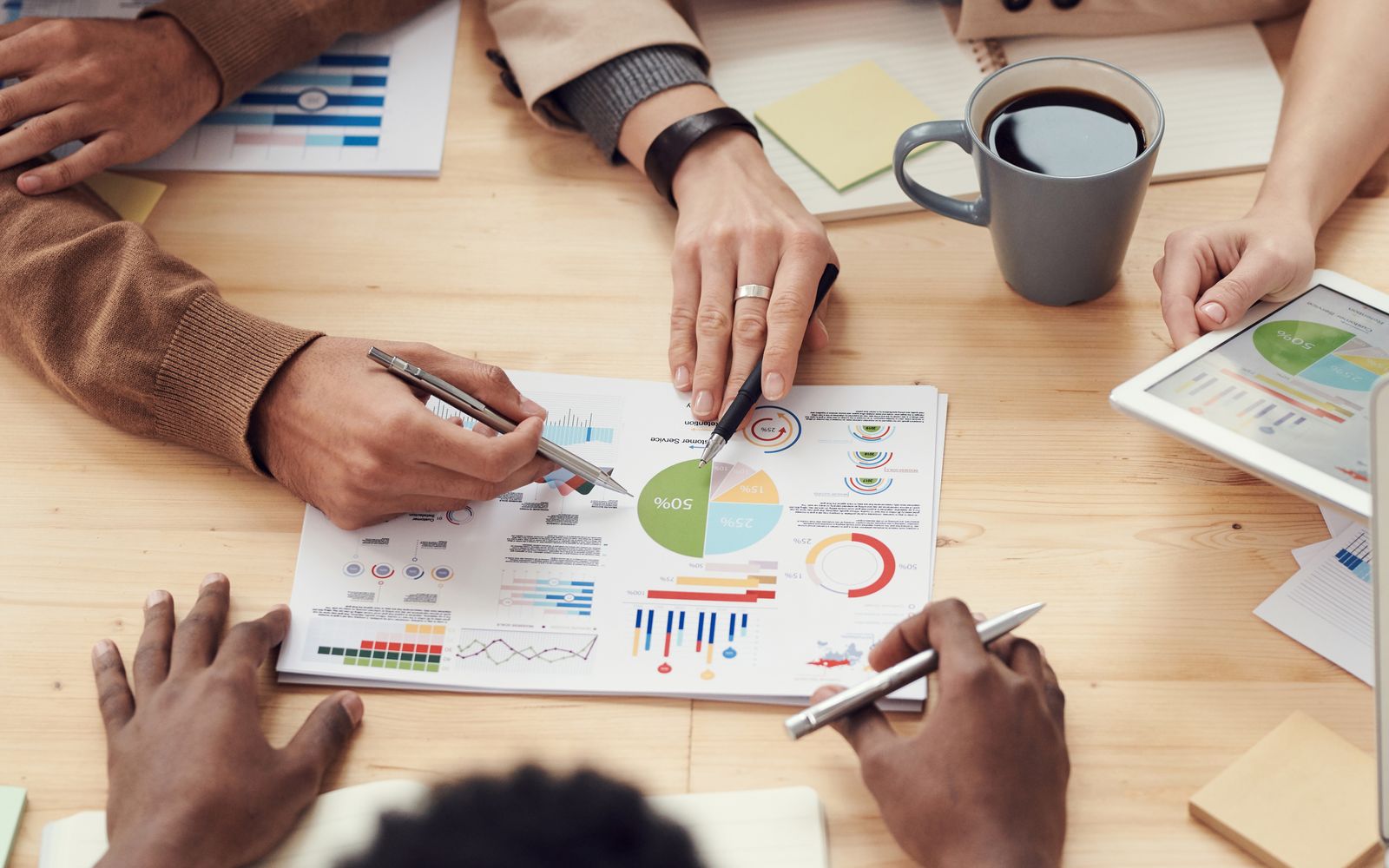 Two people reviewing the numbers behind an agency acquisition