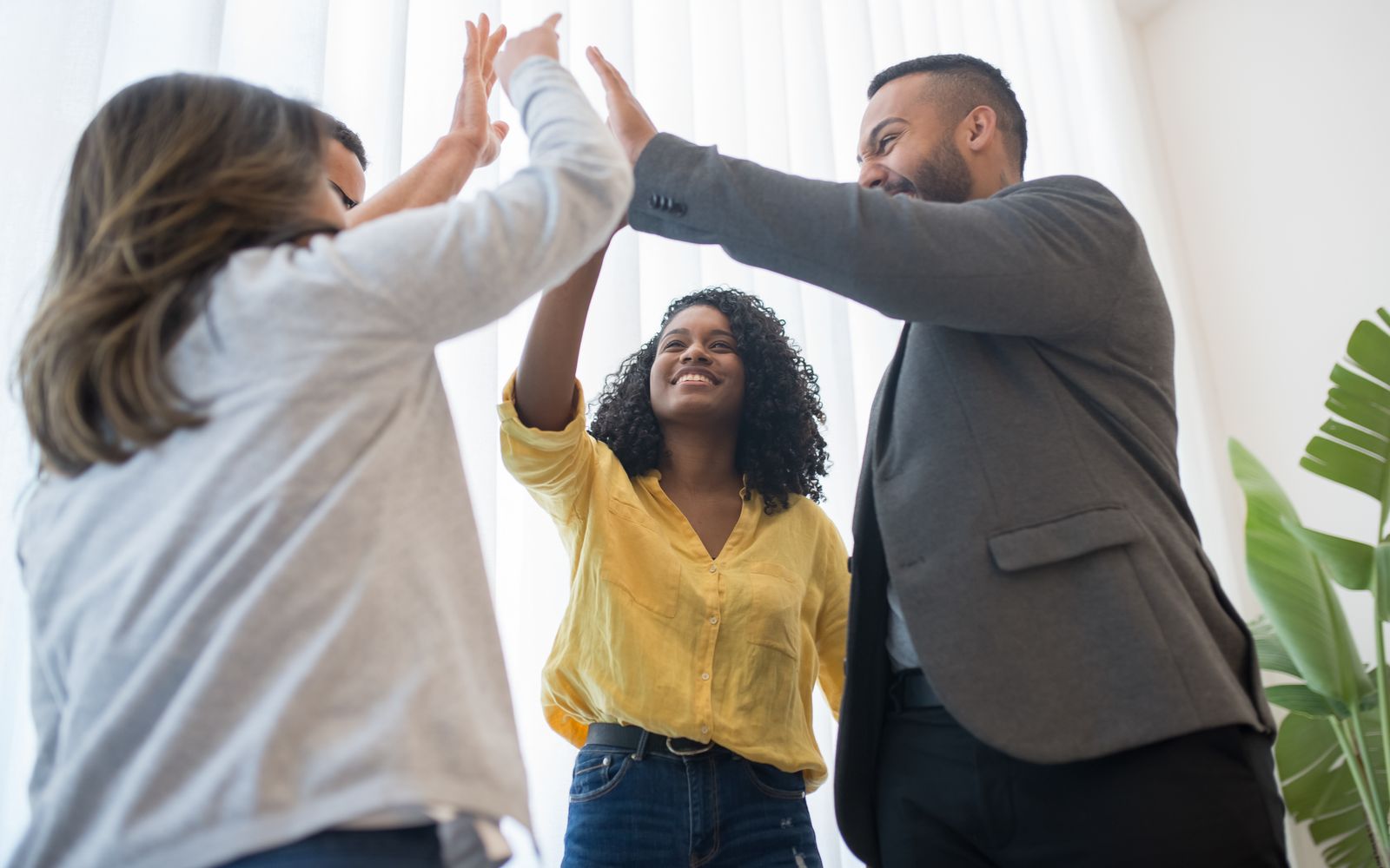 A commercial team celebrating a significant revenue result