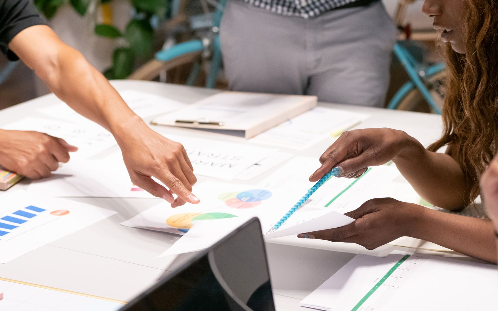 Two colleagues reviewing campaign performance for agency clients